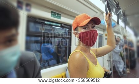 Woman Travel Caucasian Ride At Overground Train Airtrain With Wearing Protective Medical Mask. Girl 