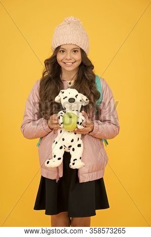 Afterschool Special. Happy Girl Go To Afterschool With Toy Dog. Little Schoolchild Yellow Background