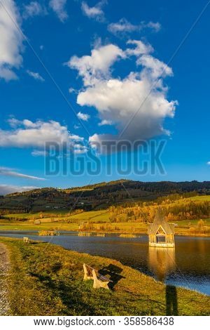 autumn pond under the mountains, Murau district,
Styria, Austria