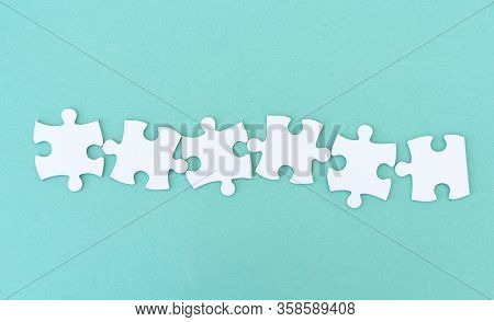 Jigsaw puzzle pieces in a row for inscription, 6 pieces