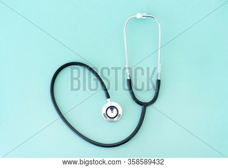 Top view of phonendoscope on blue background