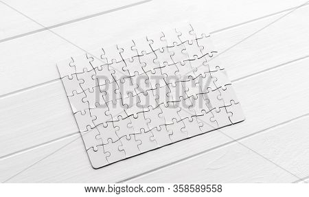 Top view of white jigsaw puzzle