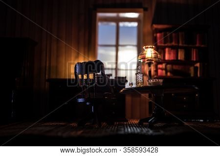 A Realistic Dollhouse Living Room With Furniture And Window At Night. Artwork Table Decoration With