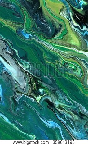 Macro Photo Of Colorful Oil Paints And Liquid Paints Fused Into Abstract Waves Pattern Background
