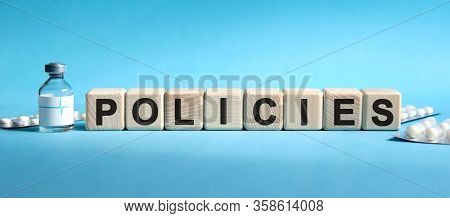 Policies - Text On Cubes. Drug In Ambula, Tablets In Blisters To Reduce Disease Symptoms