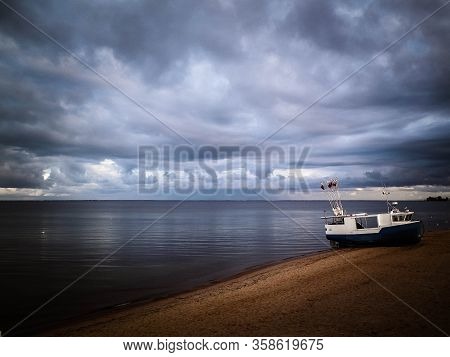 Fishing Boat On Baltic Sea Coast. Stormy Weather. Mechelinki, Poland, Pucka Bay.