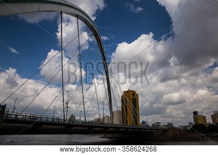 Kazakhstan, Nur-sultan - August 18, 2016: Karaotkel Bridge Near Embankment With Cloudy Sky On Backgr