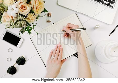 Woman Work On Laptop. Office Desk Workspace With Computer, Flowers, Sunglasses. Flat Lay, Top View W