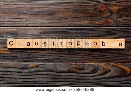 Claustrophobia Word Written On Wood Block. Claustrophobia Text On Table, Concept
