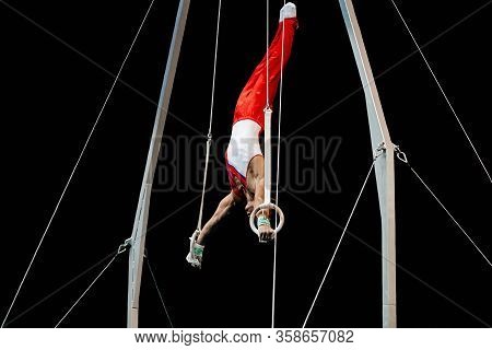 Athlete Gymnast Exercise Handstand On Still Rings Gymnastics