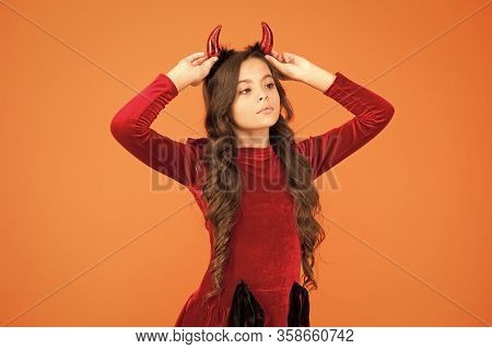 Beautiful Small Imp. Girl Red Horns Celebrate Halloween. Carnival Concept. Trick Or Treat. Halloween