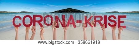 People Hands Holding Word Corona-krise Means Corona Crisis, Ocean Background