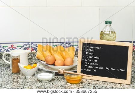 Still Life With The Ingredients For Making French Toast. Blackboard Say Eggs, Honey, Bread, Cinnamon