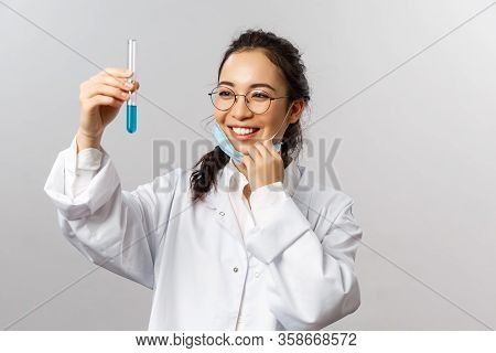 Doctors, Infectionist, Research And Covid19 Concept. Portrait Of Relieved And Plesed Asian Girl Take