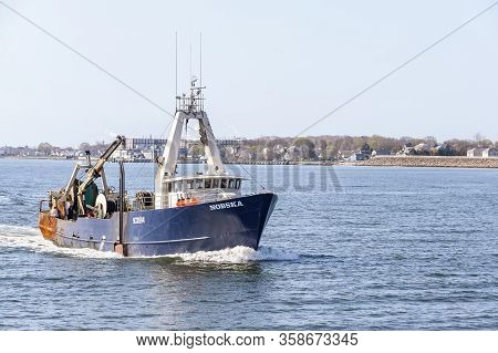 New Bedford, Massachusetts, Usa - April 24, 2019: Commercial Fishing Boat Nobska Homebound On Hazy M