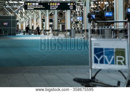 Richmond, Bc, Canada - Mar 29, 2020: Travellers In The International Departures Section Of Yvr Which
