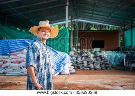 Farmer Agriculturist With Organic Fertilizer