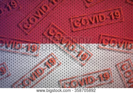 Indonesia Flag And Many Red Covid-19 Stamps. Coronavirus Or 2019-ncov Virus Concept