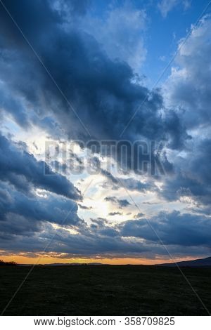 Stormy Sky With Storm Clouns On The Sunset With Beautiful Sun