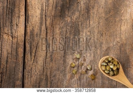 Capers In Wooden Spoon - Capparis Spinosa