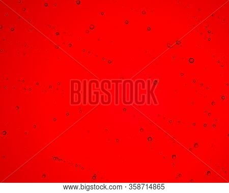 Rare Drops Of Water On A Bright Red Background