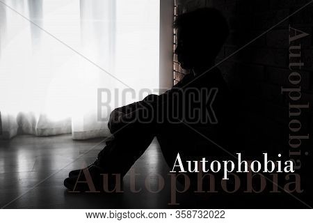 Depressed Little Boy Sitting Alone Near Brick Wall. Autophobia