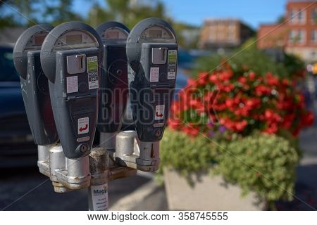 Magog, Quebec, Canada - September 8, 2018: Parking Meter On Magog Street. Travel In Canada