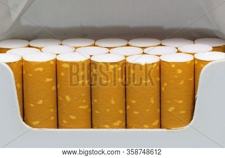 Detail Of The Filters Of Many Cigarettes Inside A Packet Just Opened By The Avid Smoker