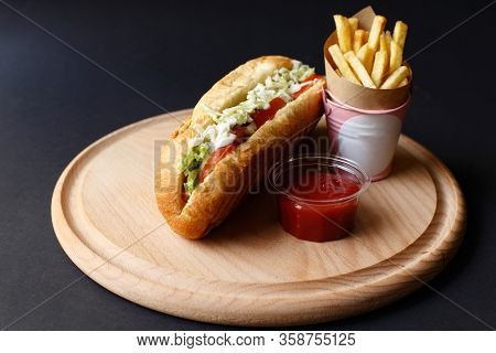 Hot Dogs With French Fries And Ketchup On Wooden Plate.