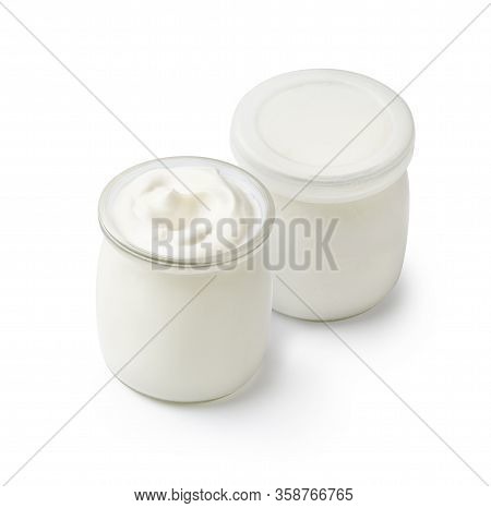 Two Jars With Natural Yogurt Isolated On White Background