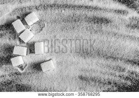Refined Sugar On Crumbled Sugar Sand. Sugar Background