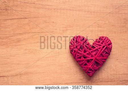 Red Heart Shape On Wooden Background With Copy Space