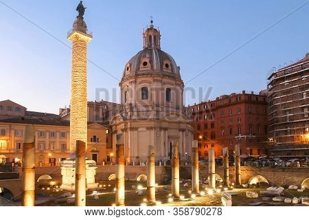 Trajans Column And The Church Of The Most Holy Name Of Mary At The Trajan Forum, Rome, Italy.