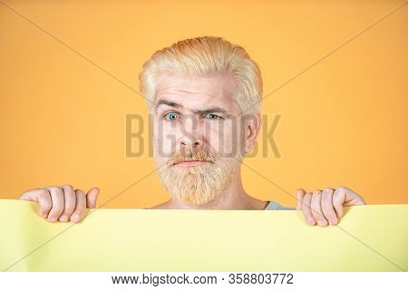Portrait Of Funny Man Showing Blank Signboard With Copyspace Area For Slogan Or Text. Blank, Empty P