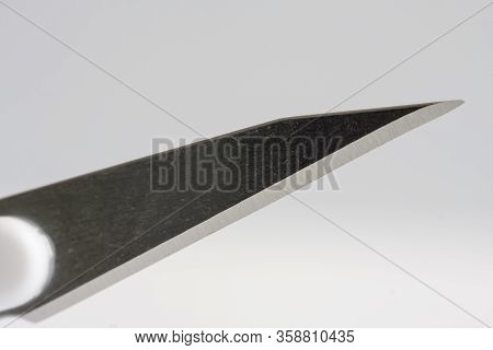 Close Up Of Medical Scalpel On White Background. Scalpel Is Used For Cannulation Of Central Venous C