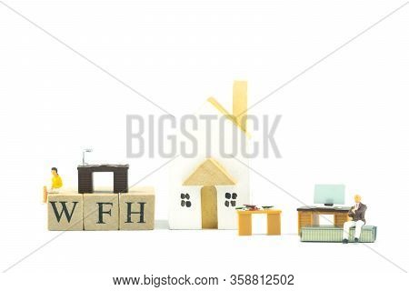 Concept Of Wfh - Work From Home Acronym.
People Work At Home To Prevent Virus Infection.