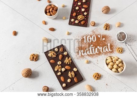 Homemade Natural Dark Chocolate Bars And Nuts On White Background. Side View, Copy Space For Text. C