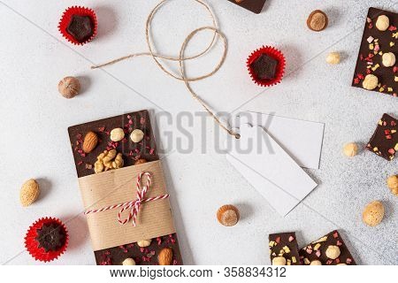 Dark Chocolate Bars And Candies With Nuts On Light Background. Homemade Organic Chocolate. Handmade 