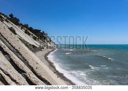 Blue abyss, a picturesque wild beach at the foot of the rocks in the vicinity of the resort of Gelendzhik. Black sea coast
