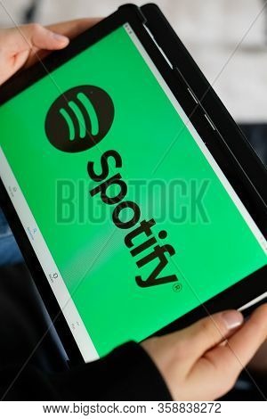 Bordeaux , Aquitaine / France - 11 30 2019 : Logo Of Spotify Screen Tablet Hands Holding Smartphone