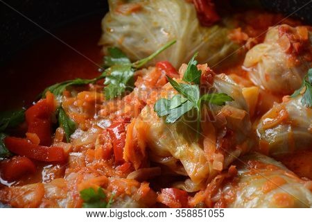 Cabbage Rolls Stuffed With Ground Beef And Rice In Tomato Sauce