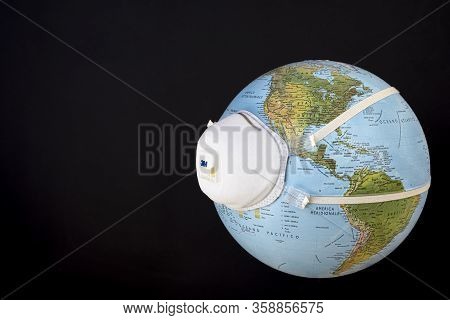 Planet Earth With Mask. Fight And Prevention Against Coronavirus. Covid-19 Prevention, Pollution And