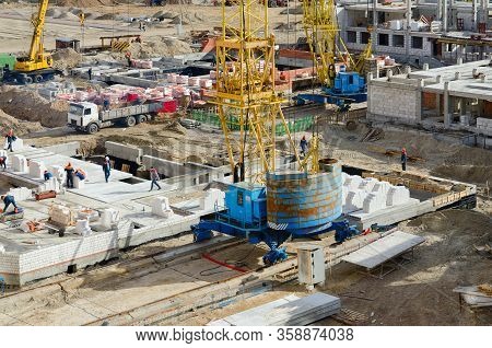 Gomel, Belarus - March 21, 2020: Unknown Builders Work On Construction Of School In New Microdistric