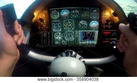 Male Hands Controlling Flight Simulator, Beginner Pilot Practicing At School