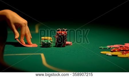 Female Hands Looking At Cards, Losing Combination In Poker, Bluffing, Bad Luck