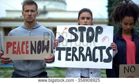 Peace Now And Stop Terracts, People Holding Signs, Protest Against Terrorism