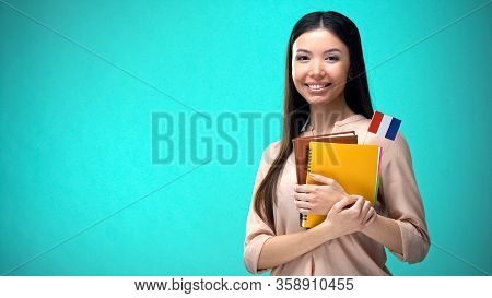 Cheerful Woman Holding French Flag Book, Education Abroad, Learning Language