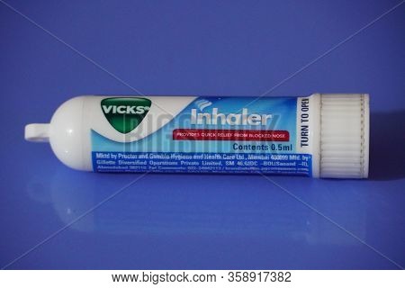 Tube Of Vicks Vapo Inhaler On An Isolated Blue Background. A 0.5 Ml Vicks Inhaler Tube Isolated. : D