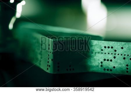 Close Up Of A Perforated Paper Tape Used To Set Up A Printer In A Film Lab