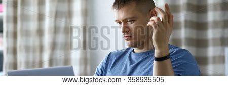 Man With Disability Is Sitting On Stroller Laptop. Guy With Disability Masters Remote Work. Emotions